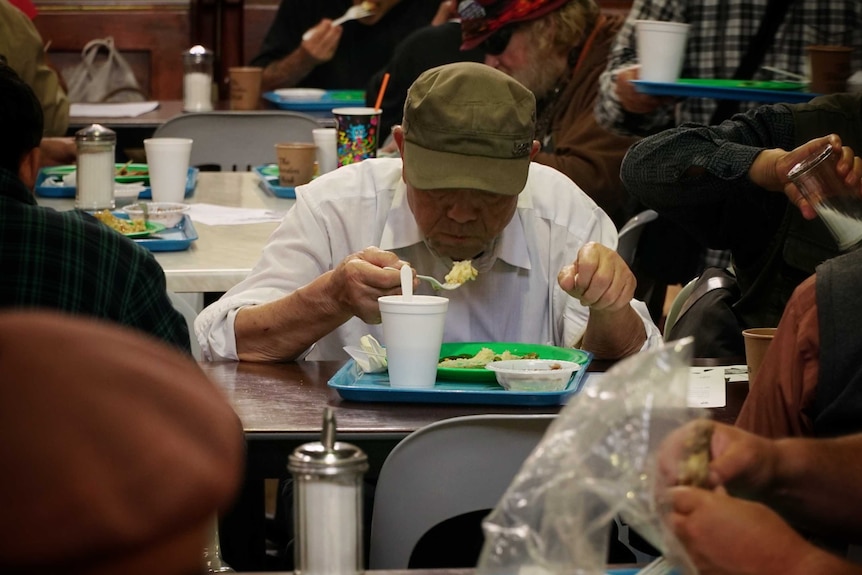 Homeless people come for food and drink at the Exodus Foundation.