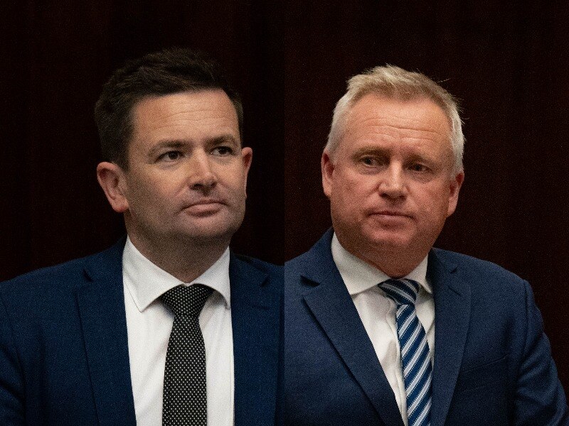 Two middle aged men in suits