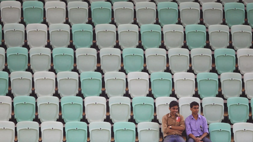 Spectators sit in near-empty stands during the Australia-Samoa netball match