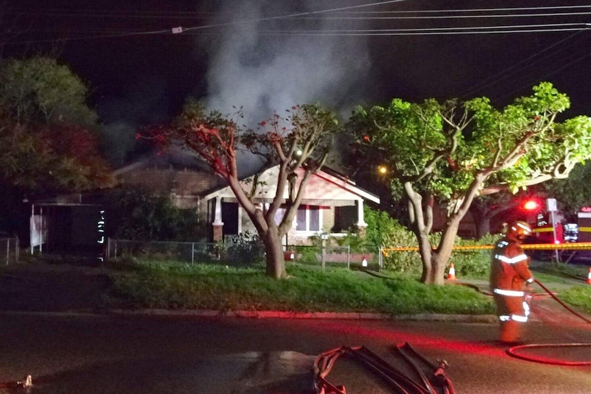 Firefighters at a house fire in the Perth suburb of Woodbridge on Harper streeti
