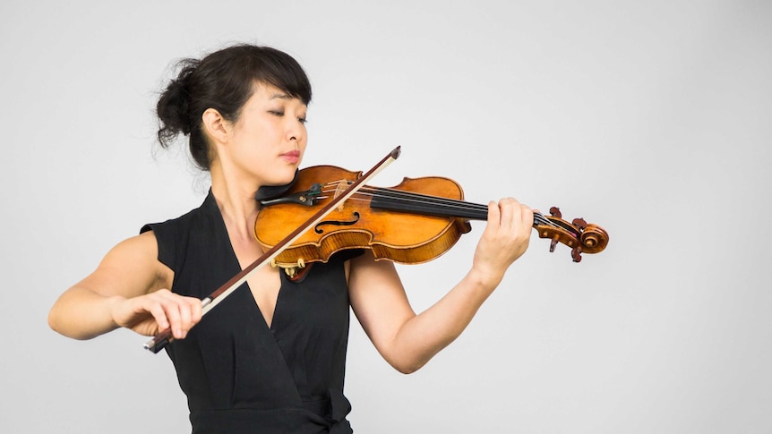Rebecca Chan with the Australian Chamber Orchestra's newly acquired Guarneri violin