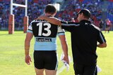 Knee injury ... Paul Gallen leaves the ground after getting injured against the Knights