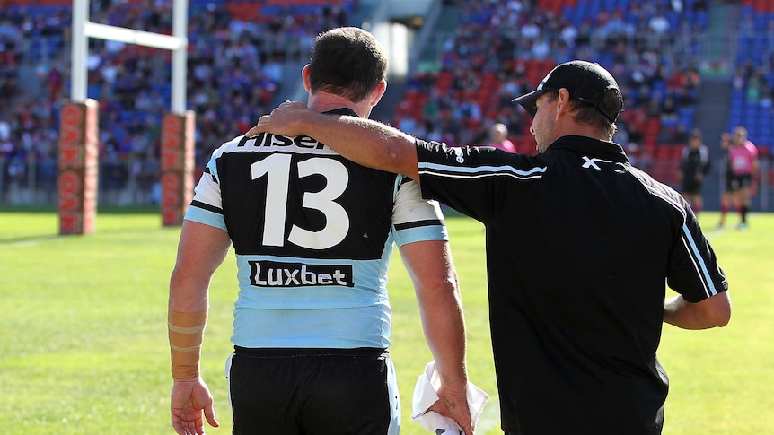 Knee injury ... Paul Gallen leaves the ground after getting injured against the Knights