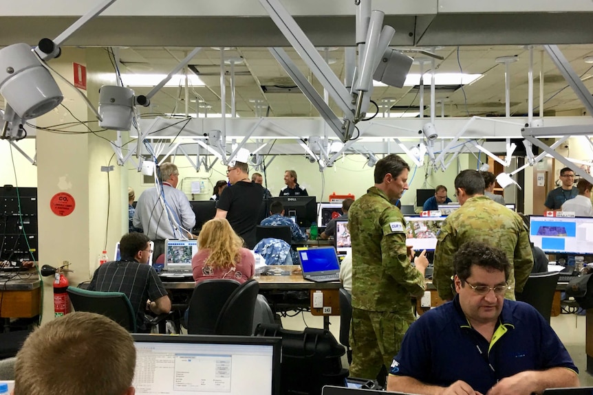 Defence and equipment personnel at an exercise command centre.