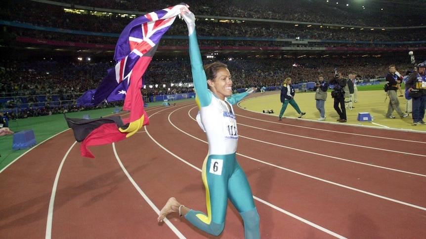 Cathy Freeman celebrates after her win at the 2000 Olympic Games.