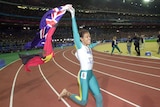 Cathy Freeman holding flags after 2000 Olympic win.