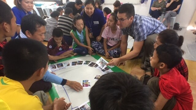 Zed Seselja takes part in a class explaining Australian life to Karen refugees in Thailand.