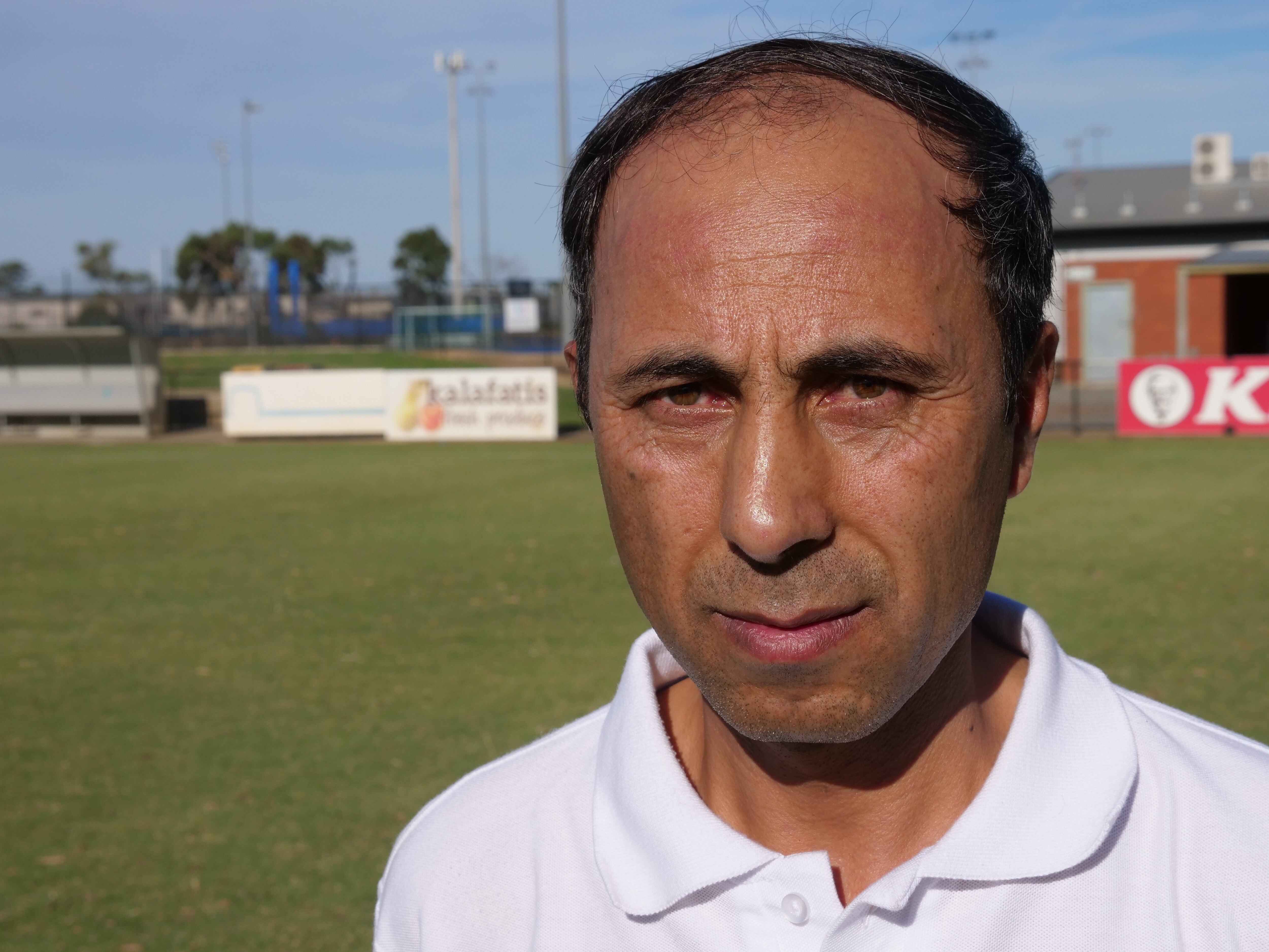 A close-up photo of a man on a football field