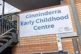 A staircase and a sign reading Ginninderra Early Childhood Centre.