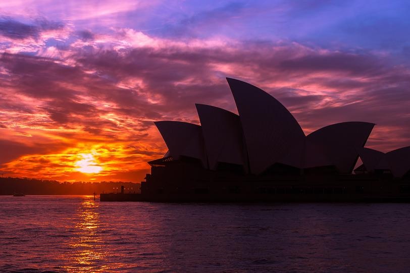 The sun sets behind the Sydney Opera house
