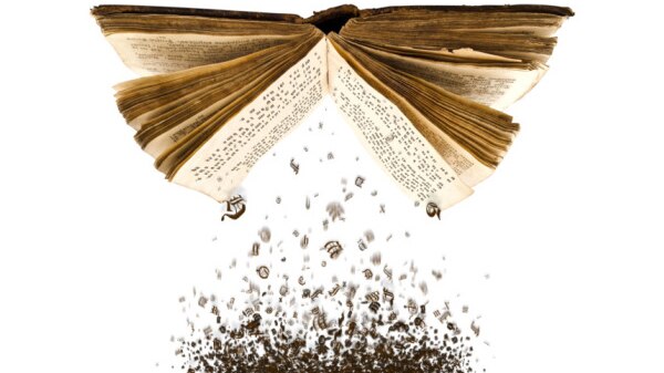 Open book with letters falling to the ground (Thinkstock: Hemera)