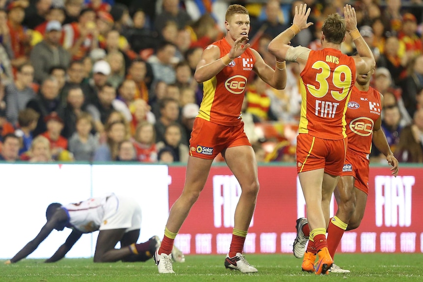 Peter Wright celebrates a goal against Brisbane