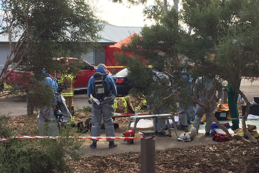 HAZMAT units outside toxic aquarium house