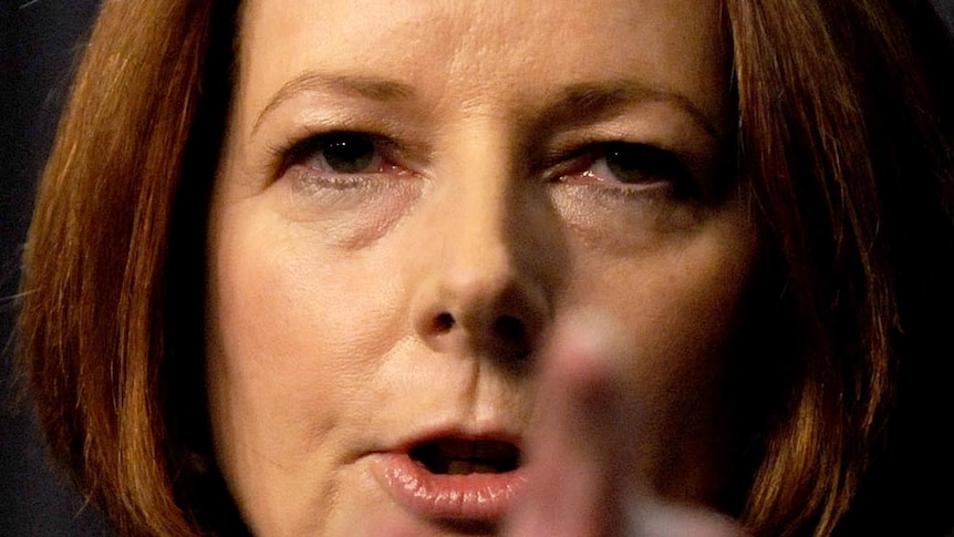 Julia Gillard points during a press conference in Canberra on October 13, 2011.