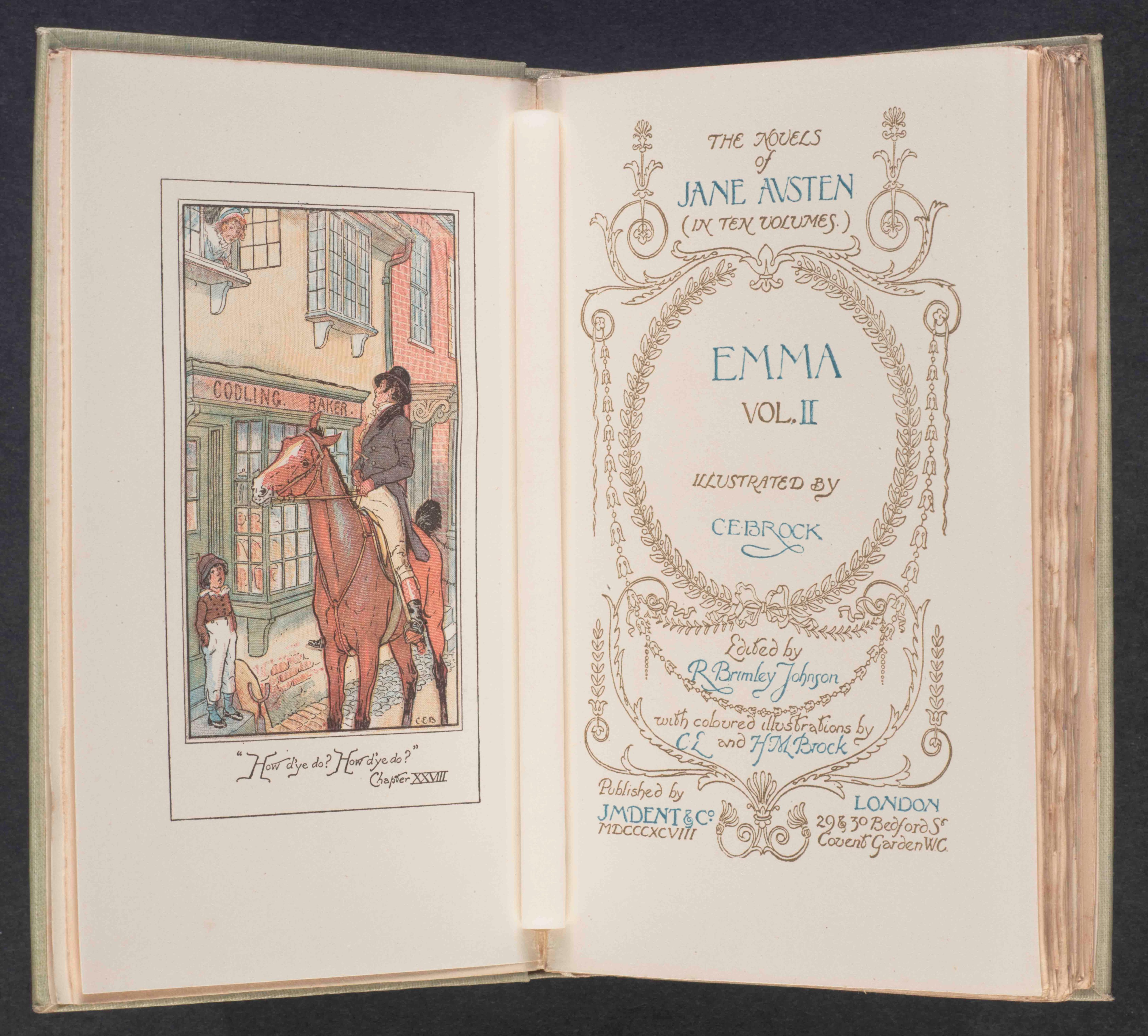 A book sits open. Inside is a colourful picture of Emma on a horse and the title page.