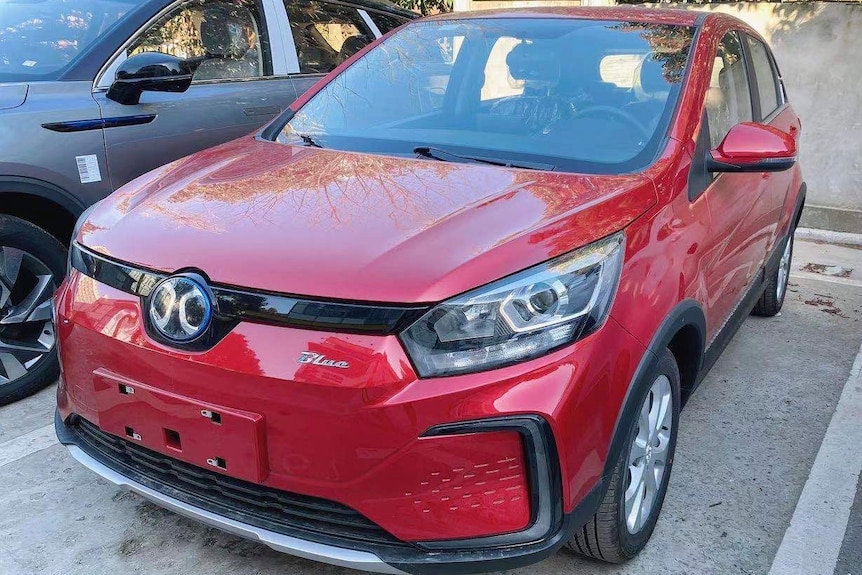 A red car parked on street.