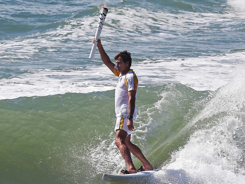 Olympic torch surfs into Brazil