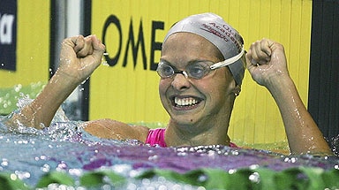 Libby Lenton celebrates breaking the her own world 100 metre freestyle record.