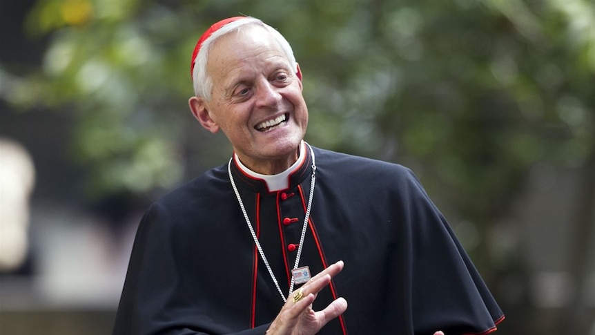 Cardinal Wuerl, Archbishop of Washington, in his red skullcap, laughing and leaning back.