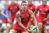 Duncan Paia'aua passes the ball during a Queensland Reds training session, January 29, 2015 in Brisbane, Australia.