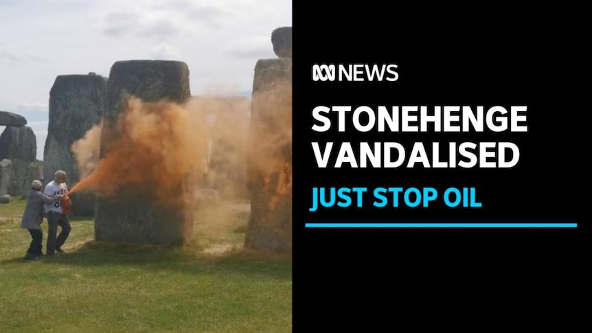 Stonehenge Vandalised, Just Stop Oil: A person sprays orange paint on Stonehenge while someone attempts to stop them.