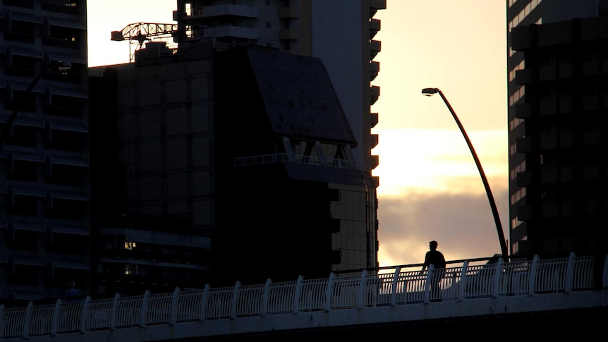 Worker walks to work in the Brisbane CBD.
