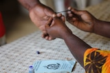 Vanuatu voter gets inked after voting.