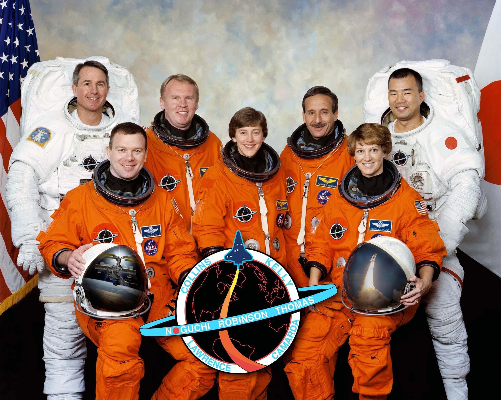 Seven astronauts in a crew portrait from 2004.
