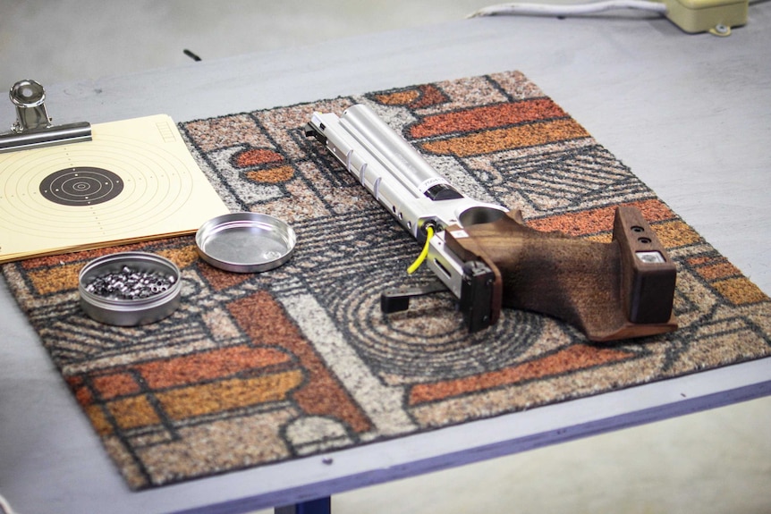 A pistol, bullets, and target at Rockhampton Pistol Club