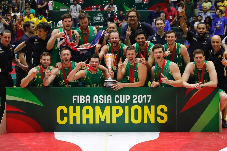 Australia's Boomers celebrate with the Asian Cup trophy.