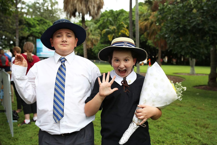 Bruno Hickey and Lulu Hickey look excited and practice their royal wave at the City Botanic Gardens.