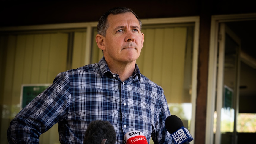 NT Chief Minister Michael Gunner wears a checkered shirt at a press conference in Darwin