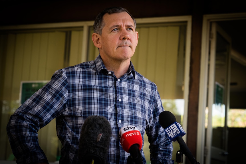 NT Chief Minister Michael Gunner wears a checkered shirt at a press conference in Darwin