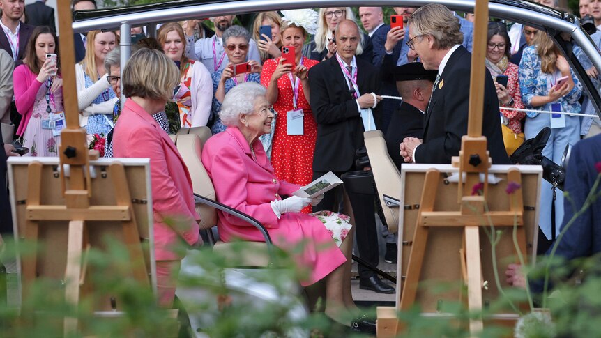  Queen Elizabeth II sitting in a buggy visits the RHS (Royal Horticultural Society) Chelsea Flower Show