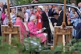  Queen Elizabeth II sitting in a buggy visits the RHS (Royal Horticultural Society) Chelsea Flower Show