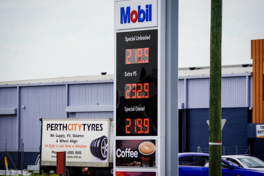 A close-up of a Mobil fuel station advertising prices of petrol. Special unleaded is 219.5.