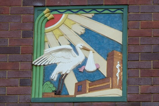 A stork motif above the entrance to the King Edward Memorial Hospital for Women.