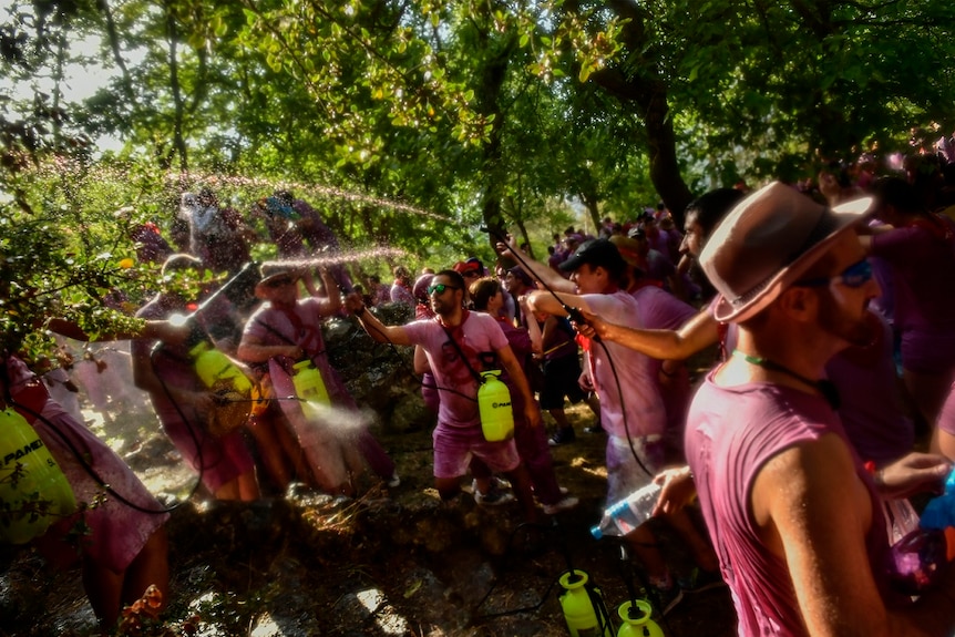 People take part in a wine battle, in the small village of Haro, northern Spain, Saturday, June 29, 2019.