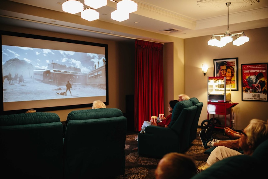 Residents watching a Western movie at a cinema at the New Direction Care facility in Bellmere.