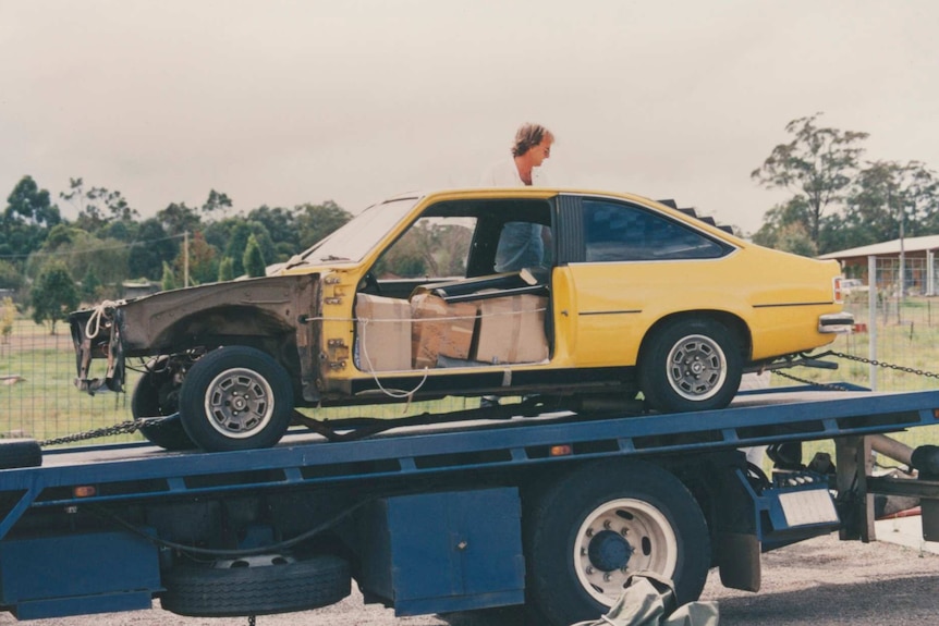 Torana on tow truck being returned to the Chamberlain family