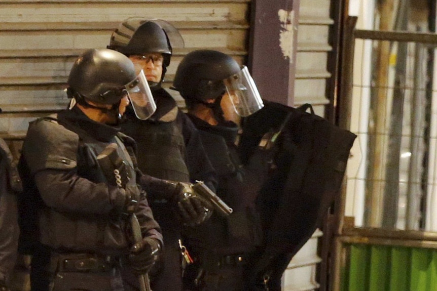 French special police forces secure the area as shots are exchanged in Saint-Denis, near Paris