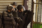 French special police forces secure the area as shots are exchanged in Saint-Denis, near Paris