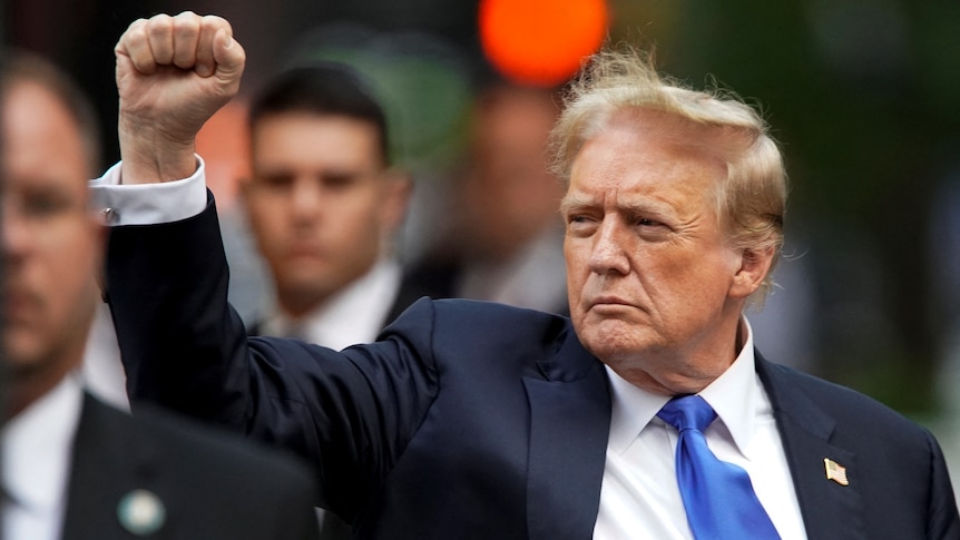 Donald Trump raises a fist 