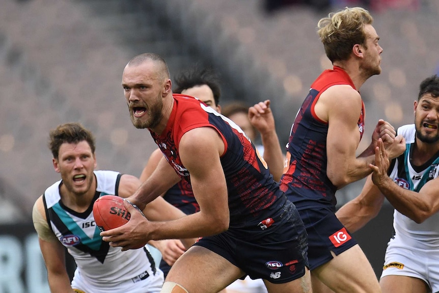Melbourne's Max Gawn (2L) in action against Port Adelaide at the MCG.