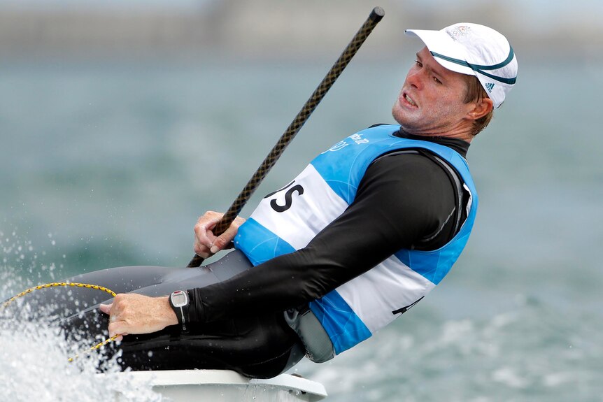 Australia's Tom Slingsby sails to victory in race eight of the men's Laser class.
