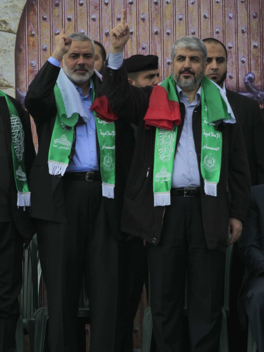 Hamas leader in exile Khaled Meshaal (R) and Hamas prime minister in the Gaza Strip Ismail Haniya (L)
