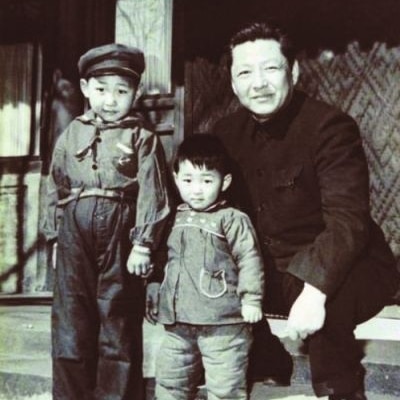 Chinese President Xi Jinping, left, younger brother Xi Yuanping, middle, and father Xi Zhongxun, right.