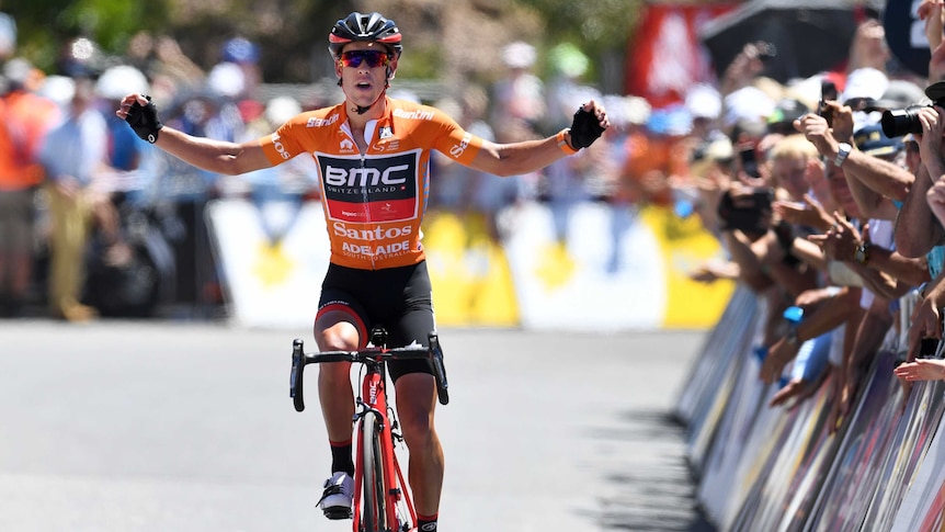 Richie Porte celebrates on Willunga Hill as he crosses the line to win stage five of the Tour Down Under