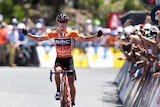 Richie Porte of team BMC is cheered by crowd on Willunga Hill as he wins Tour Down Under stage five.