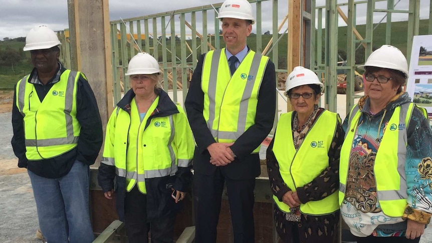 ACT Health Minister Simon Corbell with Ngunnawal elders during the construction of the Ngunnawal Bush Healing Farm south of Canberra, 8 October 2015